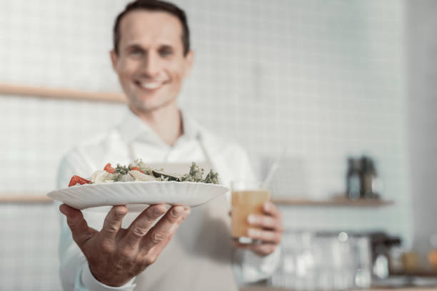 istock Focused photo on male hand that demonstrating salad 970864652