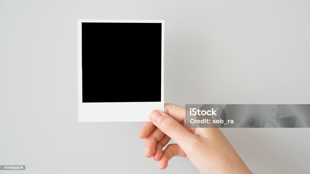 Hand halten leere Bilderrahmen - Lizenzfrei Polaroid-Transfer Stock-Foto