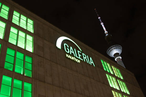 Berlin, Germany - February 22, 2018: Galeria Kaufhof at night. Galeria Kaufhof GmbH is a German department store chain acquired by Hudson's Bay Company in 2015