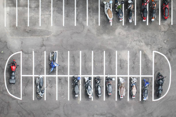 Aerial view of motorcycles parking row on concrete floor. stock photo