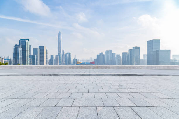 istock Panoramic skyline and modern business office buildings with empty road,empty concrete square floor 970870894