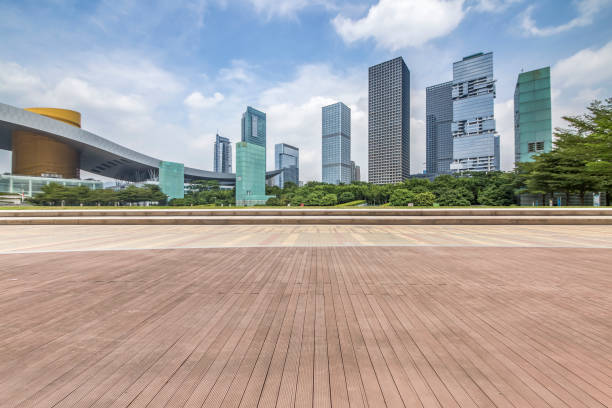 istock Panoramic skyline and modern business office buildings with empty road,empty concrete square floor 970871520