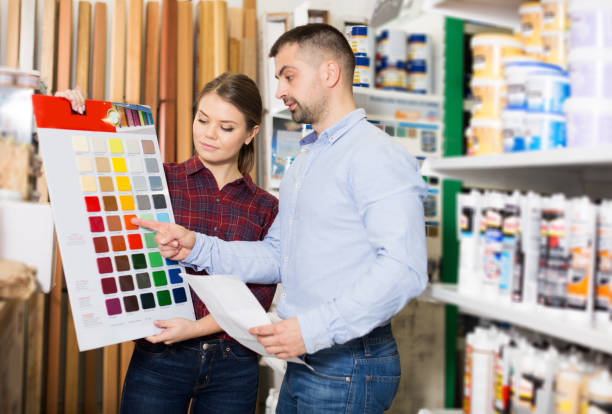 istock Two designer are looking sample of materials for repair 970872084