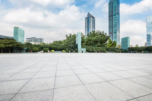 istock Panoramic skyline and modern business office buildings with empty road,empty concrete square floor 970872730