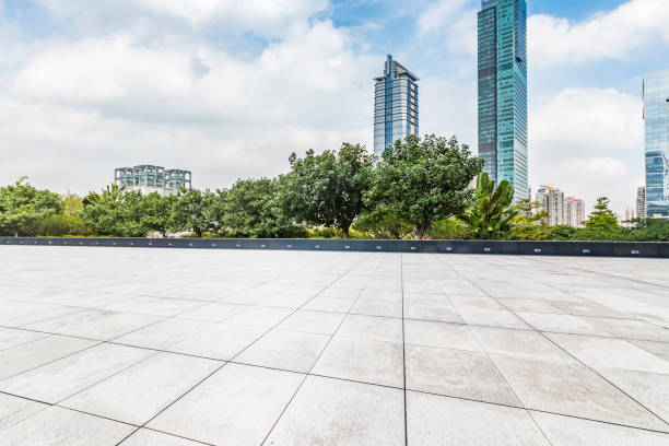 istock Panoramic skyline and modern business office buildings with empty road,empty concrete square floor 970872840