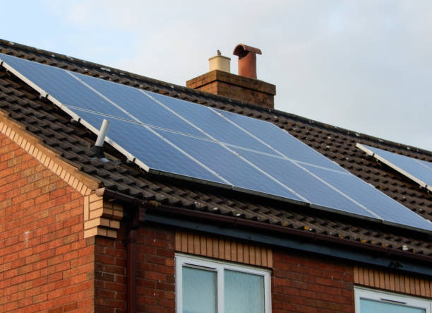 istock Solar panels mounted on a house roof in Reading. 970873024