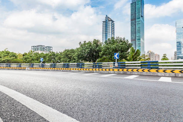 istock Panoramic skyline and modern business office buildings with empty road,empty concrete square floor 970876596
