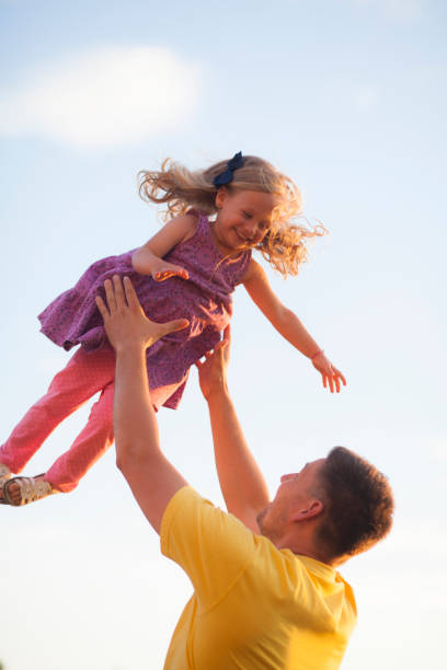 istock Father and daughter flying in the air 970886894