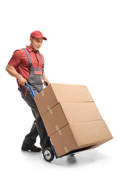istock Mover with a hand truck loaded with boxes 970888214