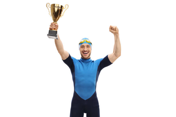 istock Overjoyed swimmer with a golden trophy 970888734