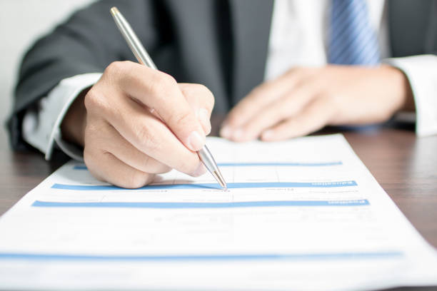 istock Businessman writing on application form and waiting for interview for get job 970891526