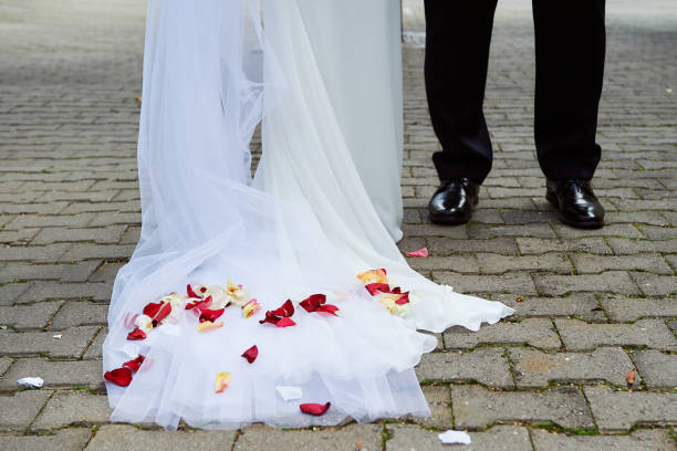istock Rose petals on bridal dresses. 970892046