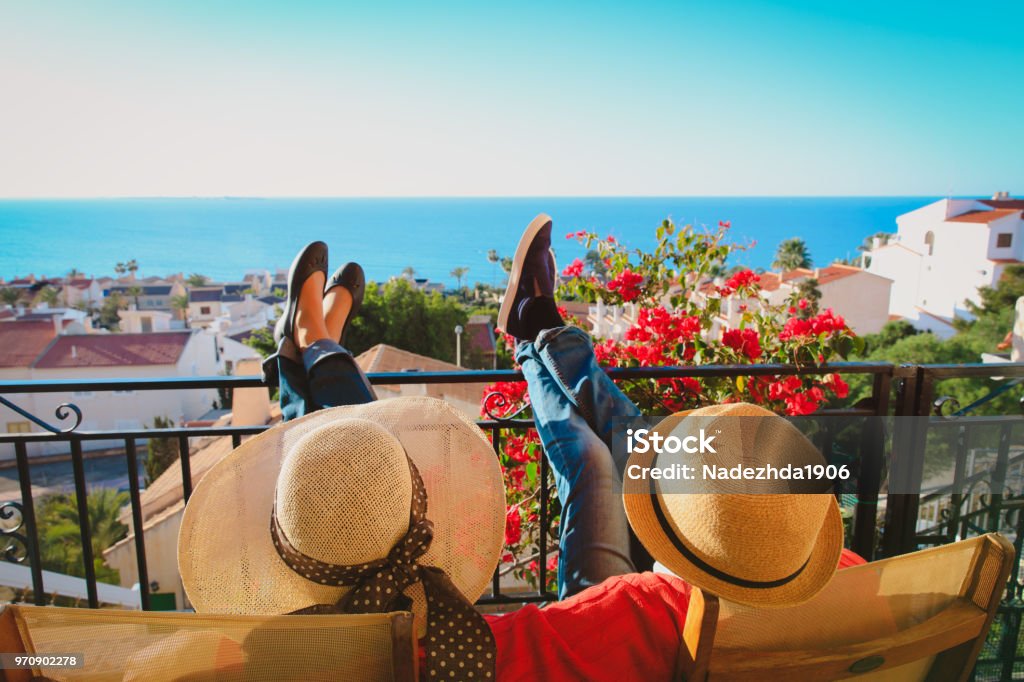 happy couple relax on balcony terrace happy couple relax on balcony terrace, on vacation in Europe Vacations Stock Photo