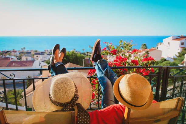 happy couple relax on balcony terrace happy couple relax on balcony terrace, on vacation in Europe espana stock pictures, royalty-free photos & images