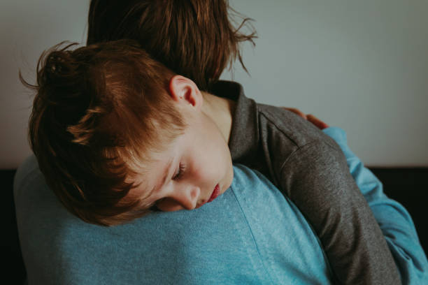 istock father comforting stressed sad son 970903998