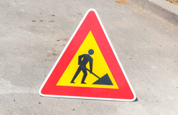 istock Work ahead caution or warning traffic road sign on the street 970904242