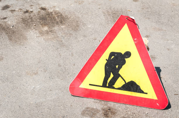 istock Work ahead caution or warning traffic road sign on the street 970904262