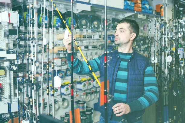 istock man choosing fishing accessories 970910798