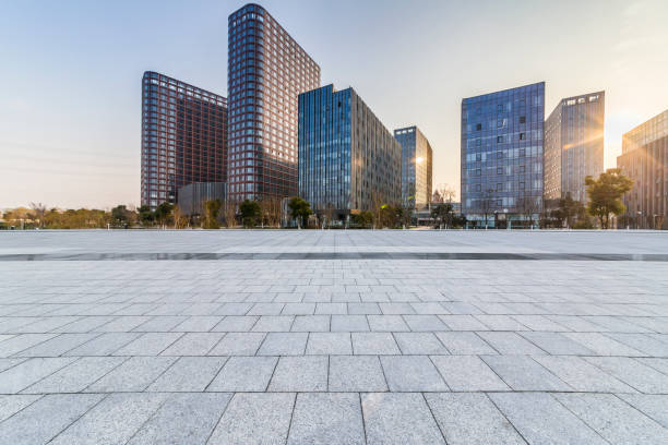 istock Panoramic skyline and modern business office buildings with empty road,empty concrete square floor 970914136