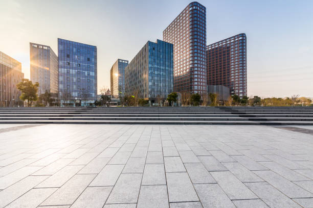 istock Panoramic skyline and modern business office buildings with empty road,empty concrete square floor 970915884