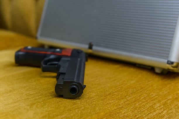 istock Organized crime, gun and suitcase 970919646