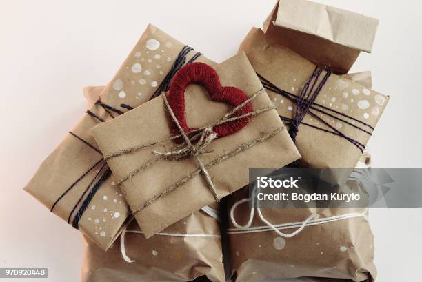 Christmas Background With Gift Boxes Wrapped In Brown Kraft Paper Flat Lay  Stock Photo - Download Image Now - iStock