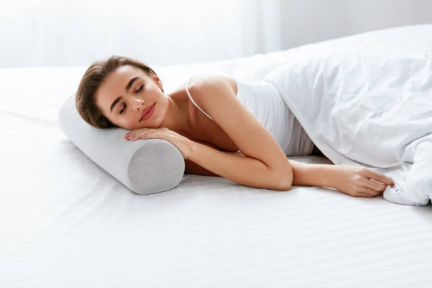 istock Neckroll Pillow. Woman Resting On Bed 970920594