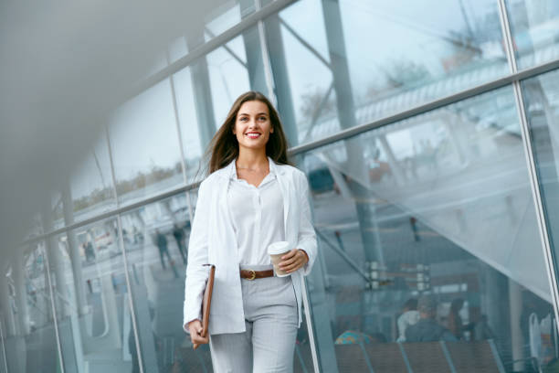 istock Beautiful Woman Going To Work With Coffee 970923518