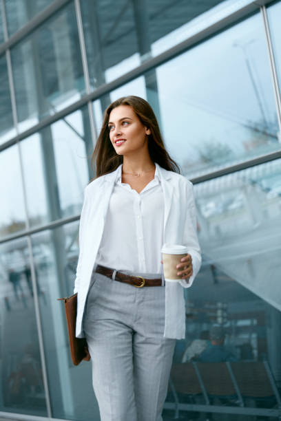 istock Beautiful Woman Going To Work With Coffee 970923532