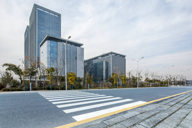 istock modern business office buildings with empty road,empty concrete square floor 970925036