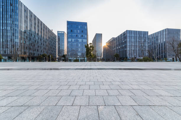 istock Panoramic skyline and modern business office buildings with empty road,empty concrete square floor 970925594