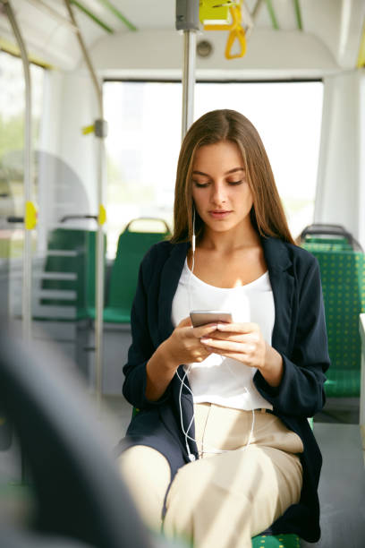 istock Woman With Phone In Public Transport. 970925624