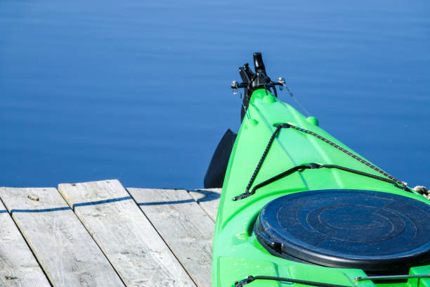 istock A green kayak on a wooden jetty / bridge deck 970928092