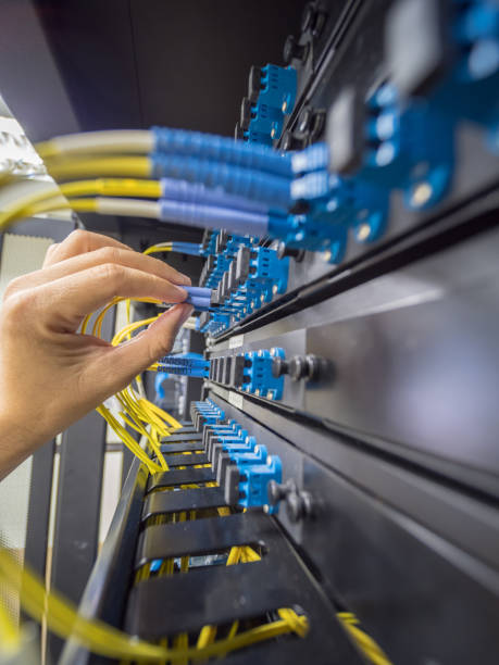 istock Hand to insert fiber optic to path panal 970928790
