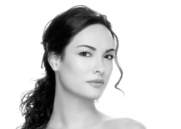 Photo of portrait of beautiful brunette woman with clean face bw