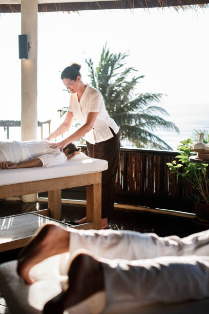 istock Massage therapist massaging at a spa 970929752