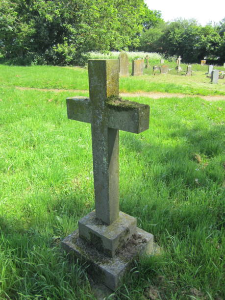 istock Stone cross memorial in churchyard 970929862