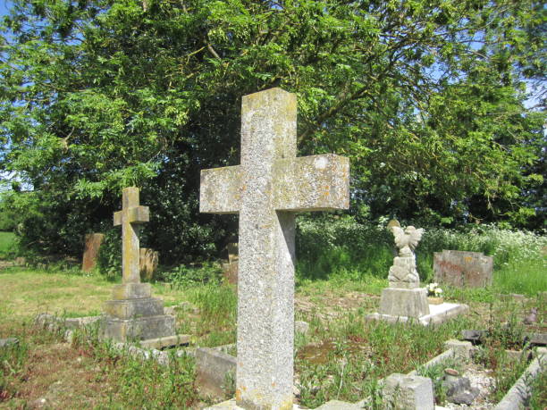 istock Stone cross memorial in churchyard 970932482