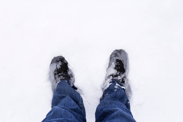 istock person walking through the snow 970933880