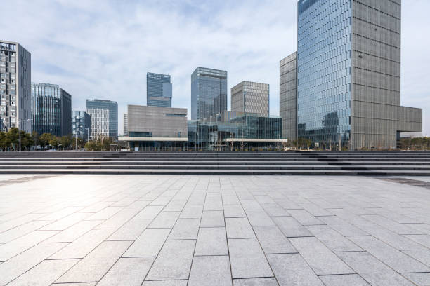 istock Panoramic skyline and modern business office buildings with empty road,empty concrete square floor 970934228