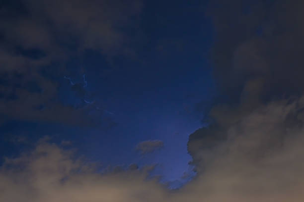 istock Stroke of lightning with storm clouds 970937252