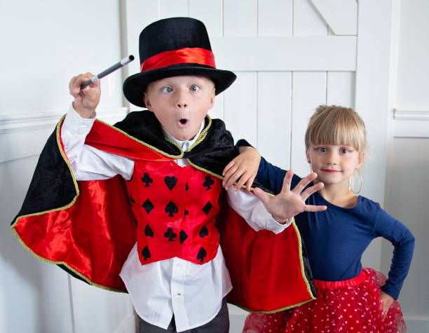 Young Magician and his Pretty Assistant Brother and Sister play magician and assistant magic show stock pictures, royalty-free photos & images