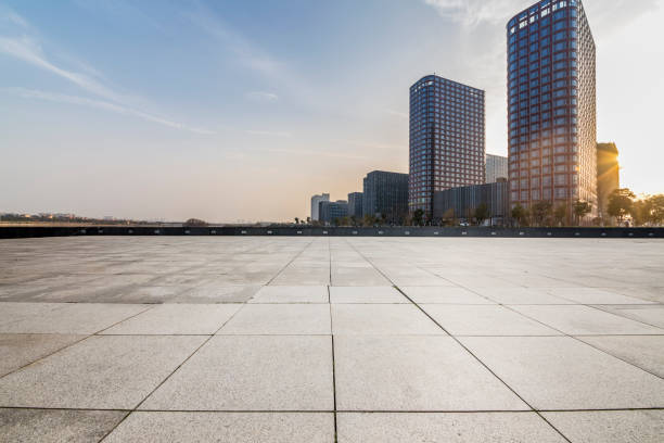 istock Panoramic skyline and modern business office buildings with empty road,empty concrete square floor 970941116