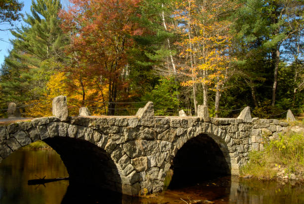 istock New Hampshire stone bridge colorful foliage background 970951414