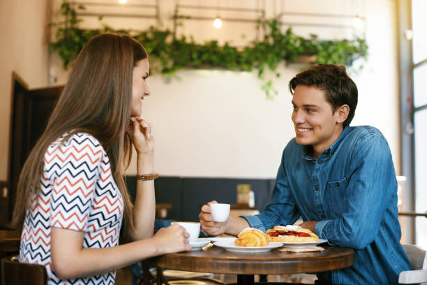 istock Couple With Coffee On Date. Beautiful Smiling People 970951432
