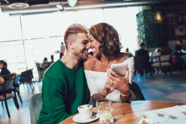 istock Mixed race couple having coffee together in cafe 970951738