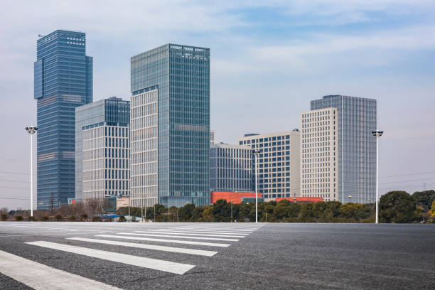istock Panoramic skyline and modern business office buildings with empty road,empty concrete square floor 970953784