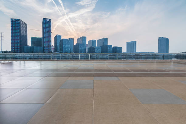 istock Panoramic skyline and modern business office buildings with empty road,empty concrete square floor 970956450