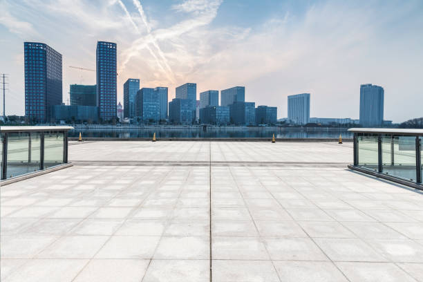 istock Panoramic skyline and modern business office buildings with empty road,empty concrete square floor 970957268