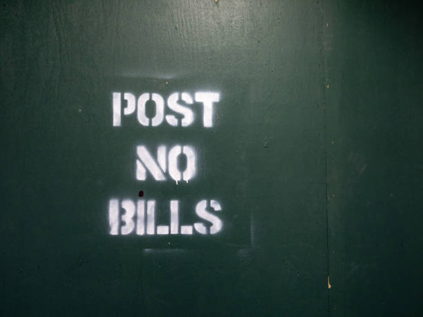 istock Post no bills spray painted warning sign at a city construction area 970958270